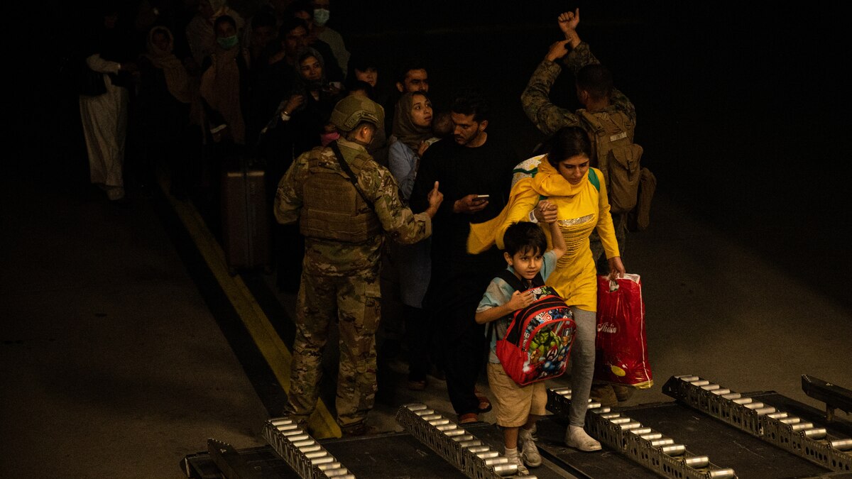 Afghan citizens board a U.S. Air Force C-17 Globemaster III at Hamid Karzai International Airport in Kabul, Afghanistan during Operation Allies Refuge, Aug. 19, 2021. Approximately 124,000 Afghan citizens were evacuated from Kabul, Afghanistan, during OAR, one of the largest air evacuations of civilians in American history. (U.S. Air Force photo by Staff Sgt. Brandon Cribelar)