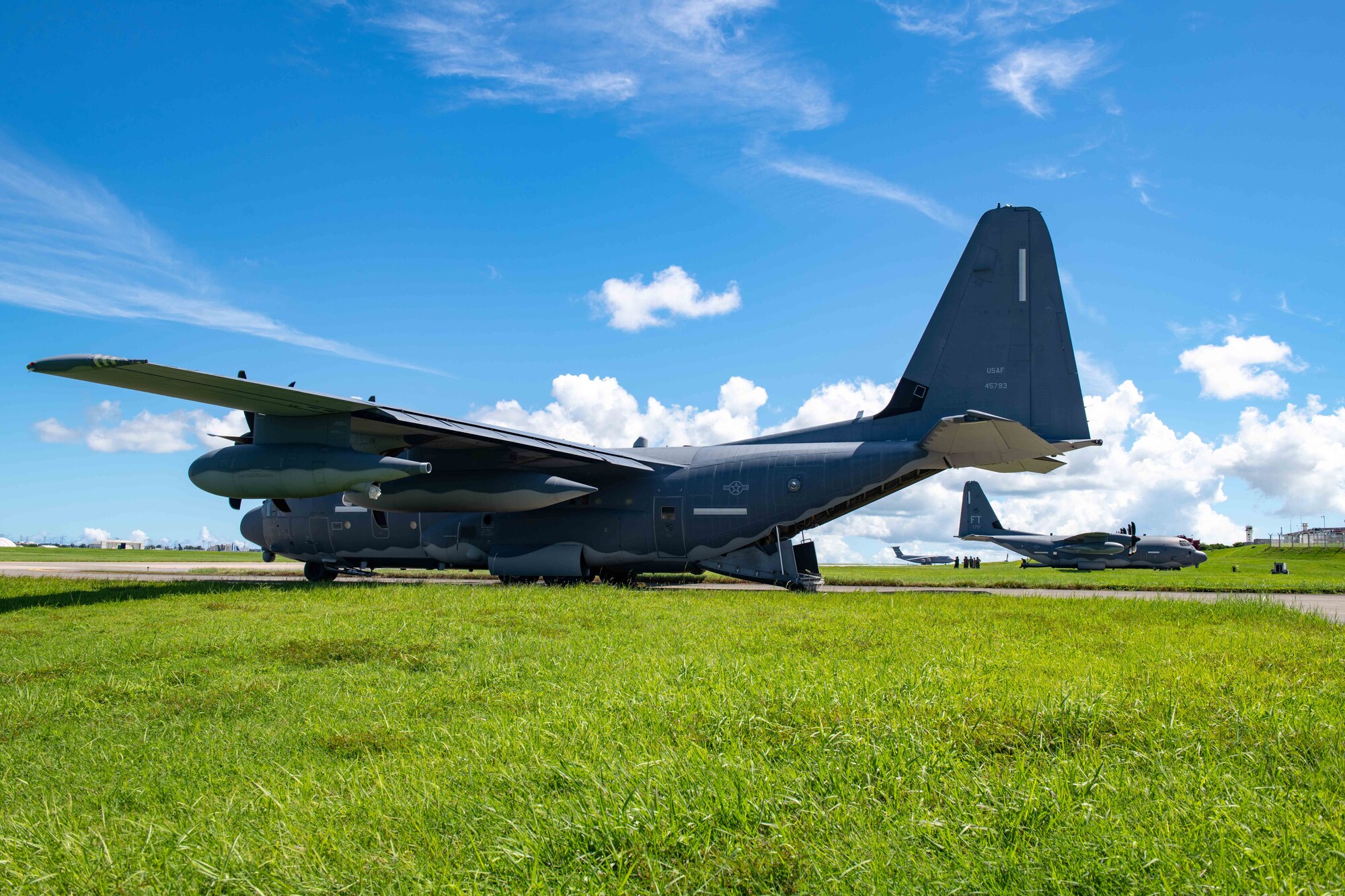 3 planes sit on the runway, getting prepped and ready to transport personnel and cargo.