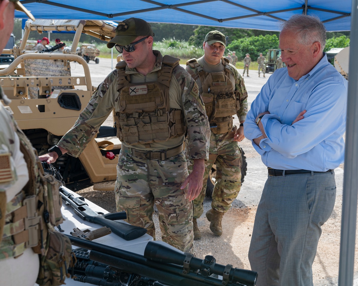 Secretary of the Air Force Frank Kendall is briefed by Maj. John Newman, 736th Security Forces Squadron commander, about the capabilities of the 736 SFS during his visit at Andersen Air Force Base, Guam, Aug. 19, 2022.