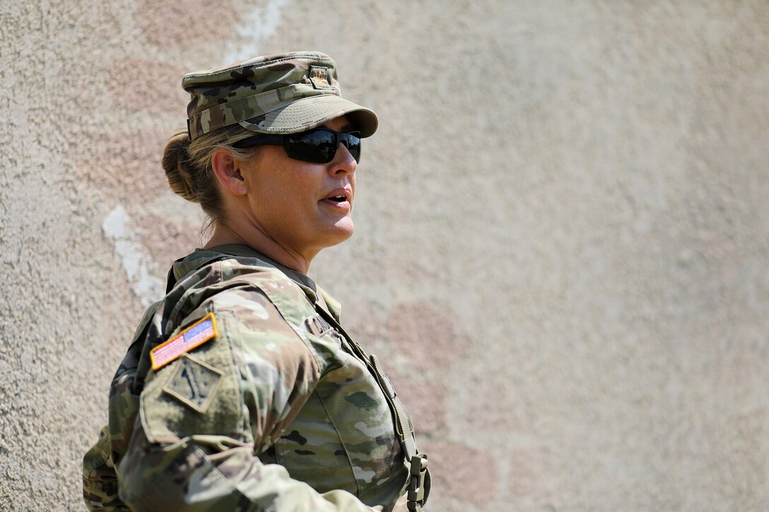 U.S. Army Reserve Maj. Kristin Caulfield, Observer Coach/Trainer, Team Lead, 2-361st Training Support Battalion, 85th U.S. Army Reserve Support Command, observes lanes training during CSTX 86-22-02 at Fort McCoy, Wisconsin, August 16, 2022.