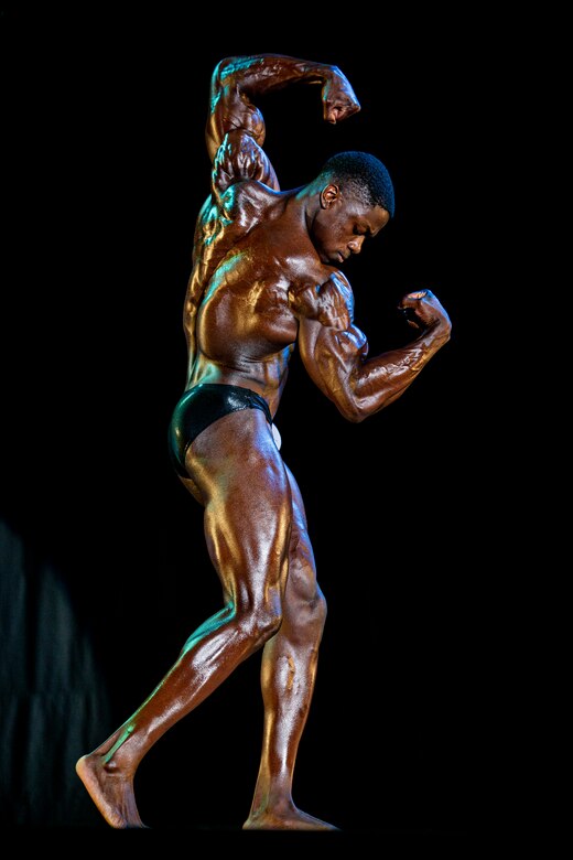 U.S. Marine Corps Cpl. Jason Joseph, a military police officer with Provost Marshal’s Office, Headquarters and Support Battalion, Marine Corps Installations Pacific, performs a free pose during the 2022 Far East Bodybuilding Competition at the Camp Foster Base Theater, Okinawa, Japan, July 17, 2022. Joseph began his bodybuilding journey in 2022 and has competed in two bodybuilding competitions, earning him a second and third place medal in each respectively, and aims to become an International Federation of Bodybuilding and Fitness Professional. (U.S. Marine Corps photo by Cpl. Alex Fairchild)