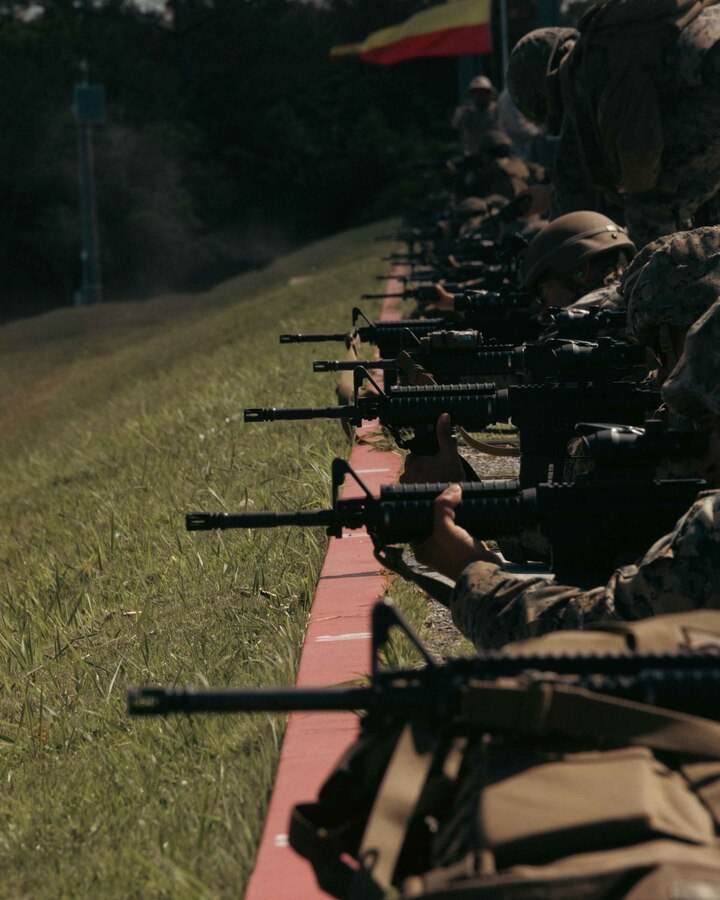 U.S. Marines participating in the Annual Rifle Qualification fire from the 300-yard line during the ARQ on Camp Hansen, Okinawa, Japan, Aug. 2, 2022. The Marine Corps implemented the new ARQ 10 months ago to replace the Annual Rifle Training. During the new ARQ, Marines use the standing, kneeling, and prone positions with artificial support to simulate realistic shooting positions in combat, improving proficiency as riflemen. (U.S. Marine Corps photo by Lance Cpl. Jonathan Beauchamp)