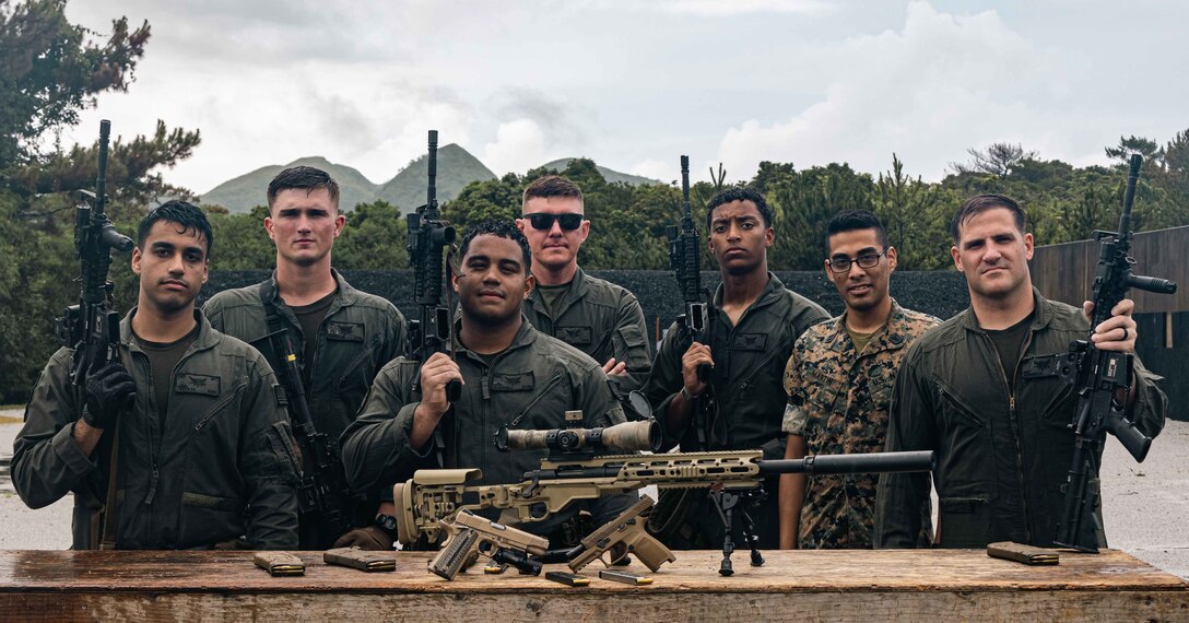 U.S. Marines and Naval personnel with Special Reaction Team, Headquarters and Support Battalion, Marine Corps Installations Pacific, pose for a photo during multiple weapons sustainment training on Camp Hansen, Okinawa, Japan, Aug. 11, 2022. The members of SRT are attached to the Provost Marshal’s Office and are specifically trained and equipped to react in scenarios like an active shooter, hostage situations, and barricaded subjects. (U.S. Marine Corps photo by Lance Cpl. Jonathan Beauchamp)