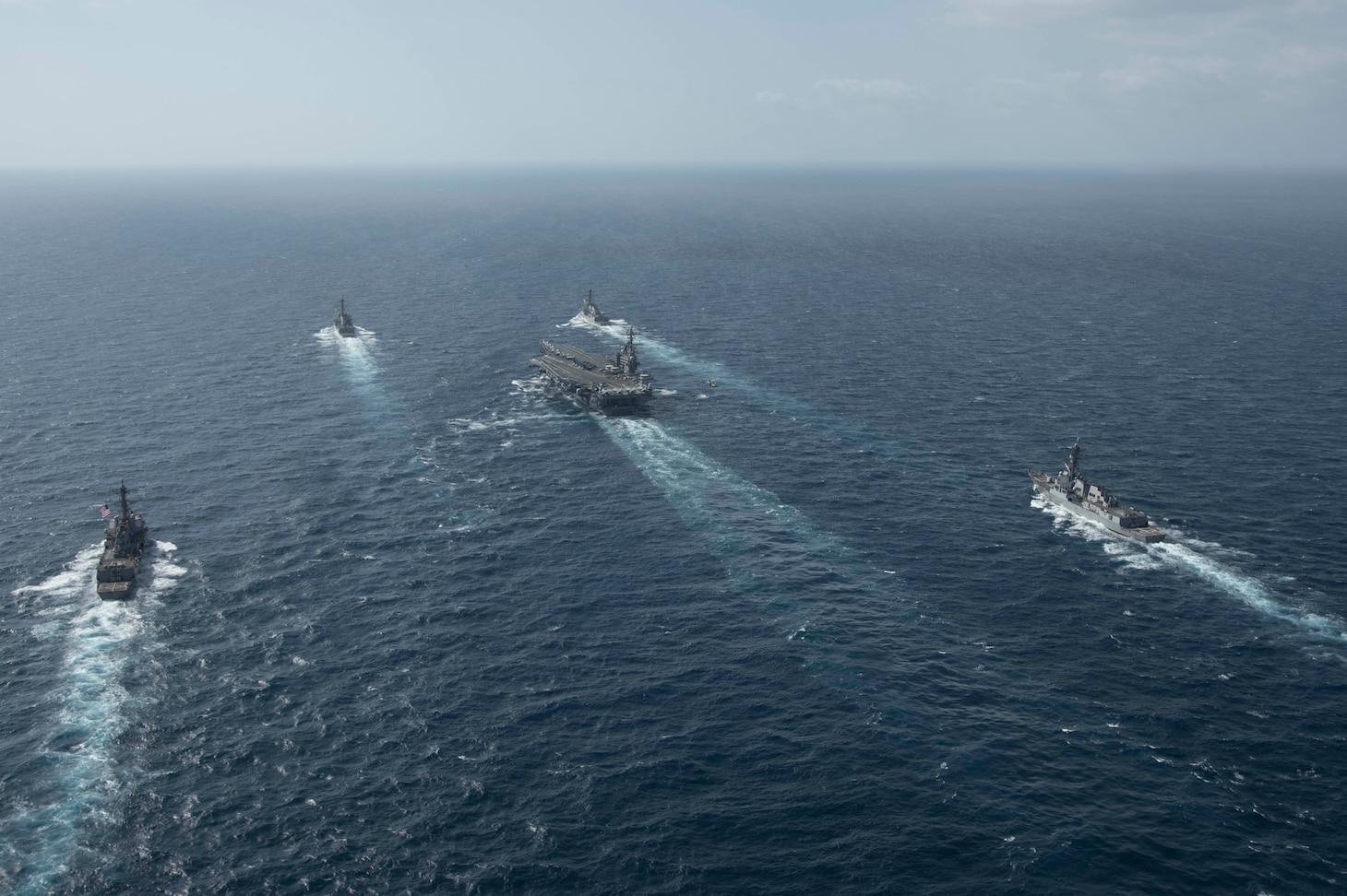 Ships from the George H.W. Bush Carrier Strike Group (GHWBCSG) transit the Atlantic Ocean during a straits transit training event.