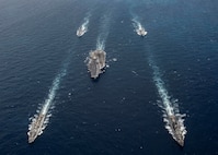 Ships from the George H.W. Bush Carrier Strike Group (GHWBCSG) transit the Atlantic Ocean following a straits transit training event. GHWBCSG is underway completing Group Sail as part of the routine training cycle.