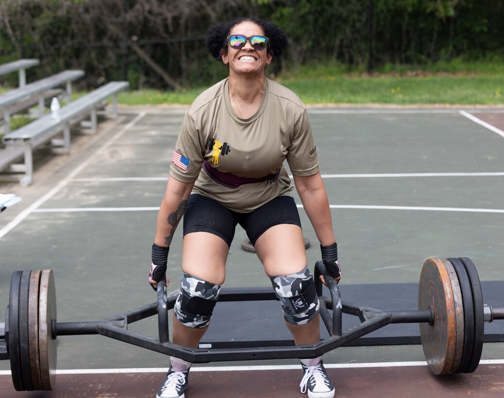 Soldier lifts weight during competition.