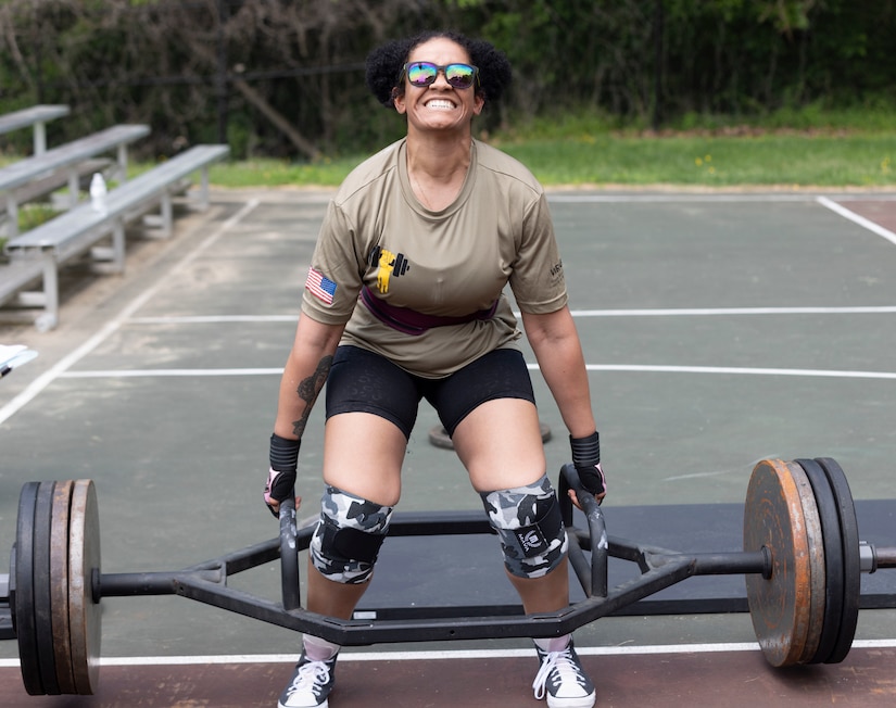 Soldier lifts weight during competition.