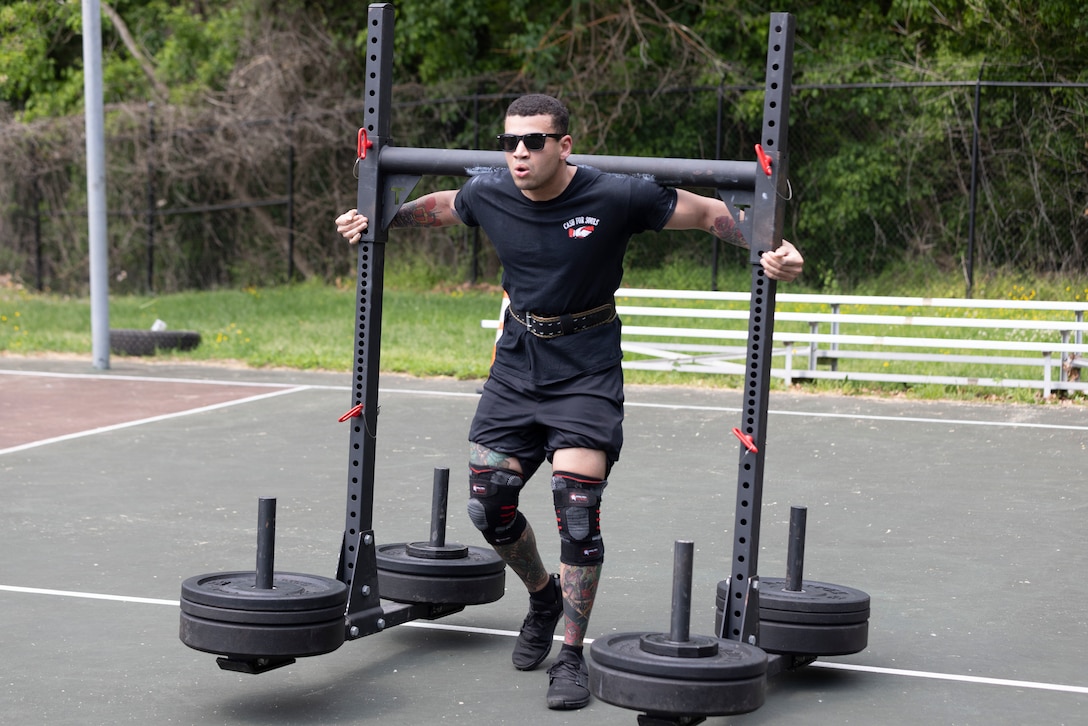 Soldier performs the Yoke Walk during competition.