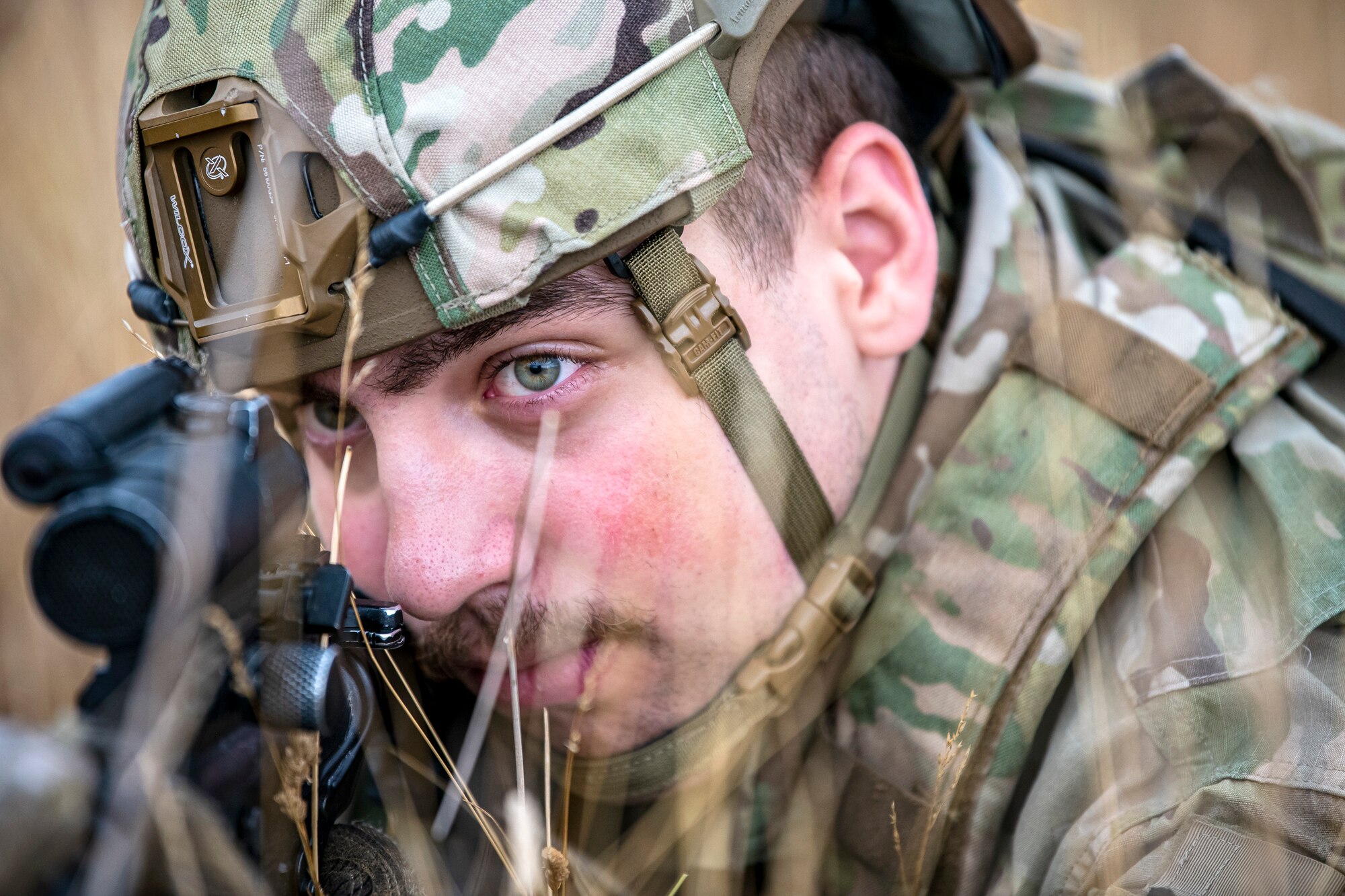 U.S. Air Force Airman 1st Class Daniel Richards, 423d Security Forces Squadron entry control operator, lays prone while looking down the sight of an M4 carbine during a field training exercise at Stanford Training Area, England, Aug. 17, 2022. Instructors from the 820th Base Defense Group and 435th Security Forces Squadron Ground Combat Readiness Training Center, conducted the exercise to evaluate and bolster the combat readiness skills of the defenders from the 423d SFS. (U.S. Air Force photo by Staff Sgt. Eugene Oliver)