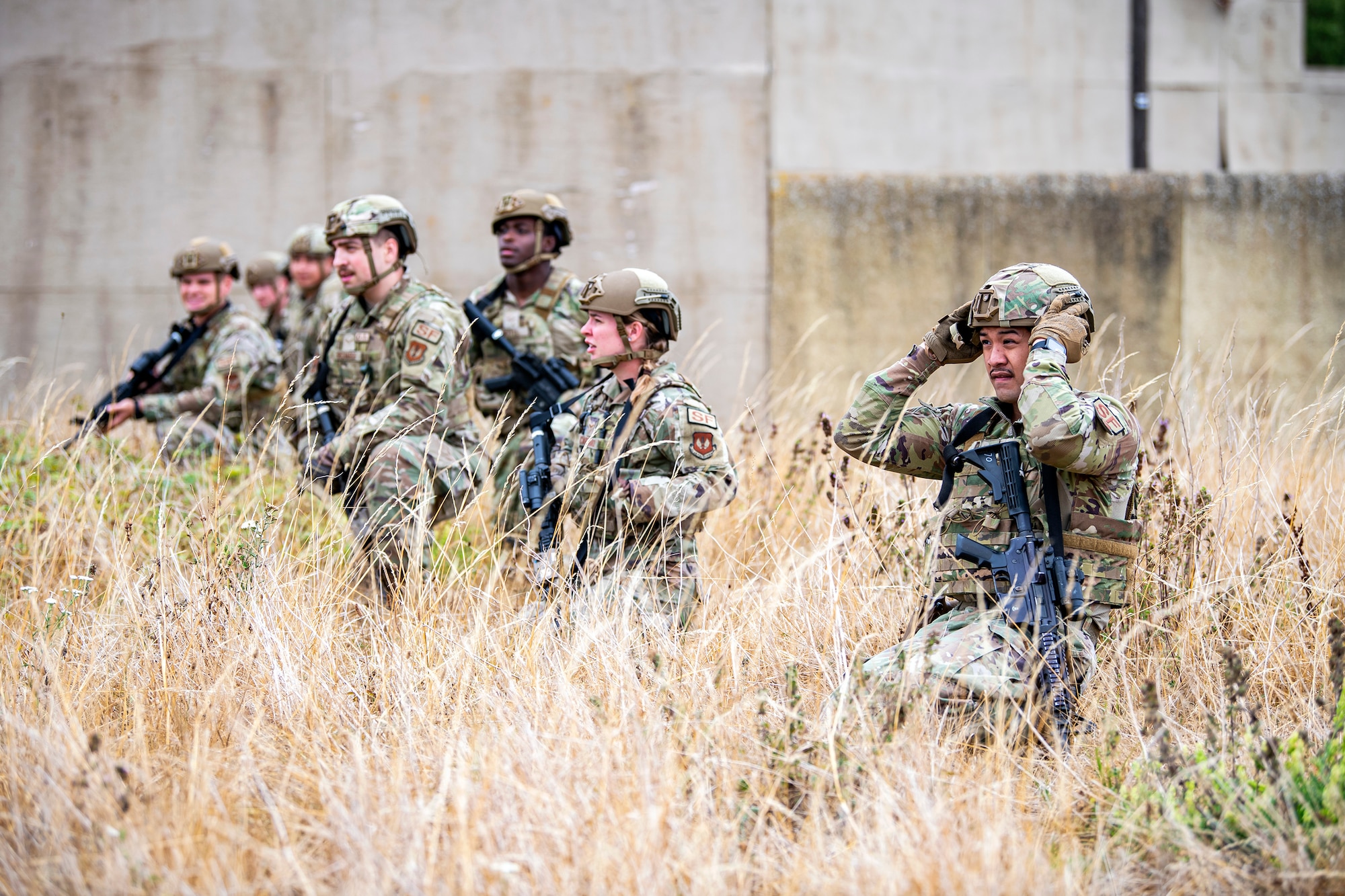 Airmen from the 423d Security Forces Squadron hold a formation during a field training exercise at Stanford Training Area, England, Aug. 17, 2022. Instructors from the 820th Base Defense Group and 435th Security Forces Squadron Ground Combat Readiness Training Center, conducted the exercise to evaluate and bolster the combat readiness skills of the defenders from the 423d SFS. (U.S. Air Force photo by Staff Sgt. Eugene Oliver)