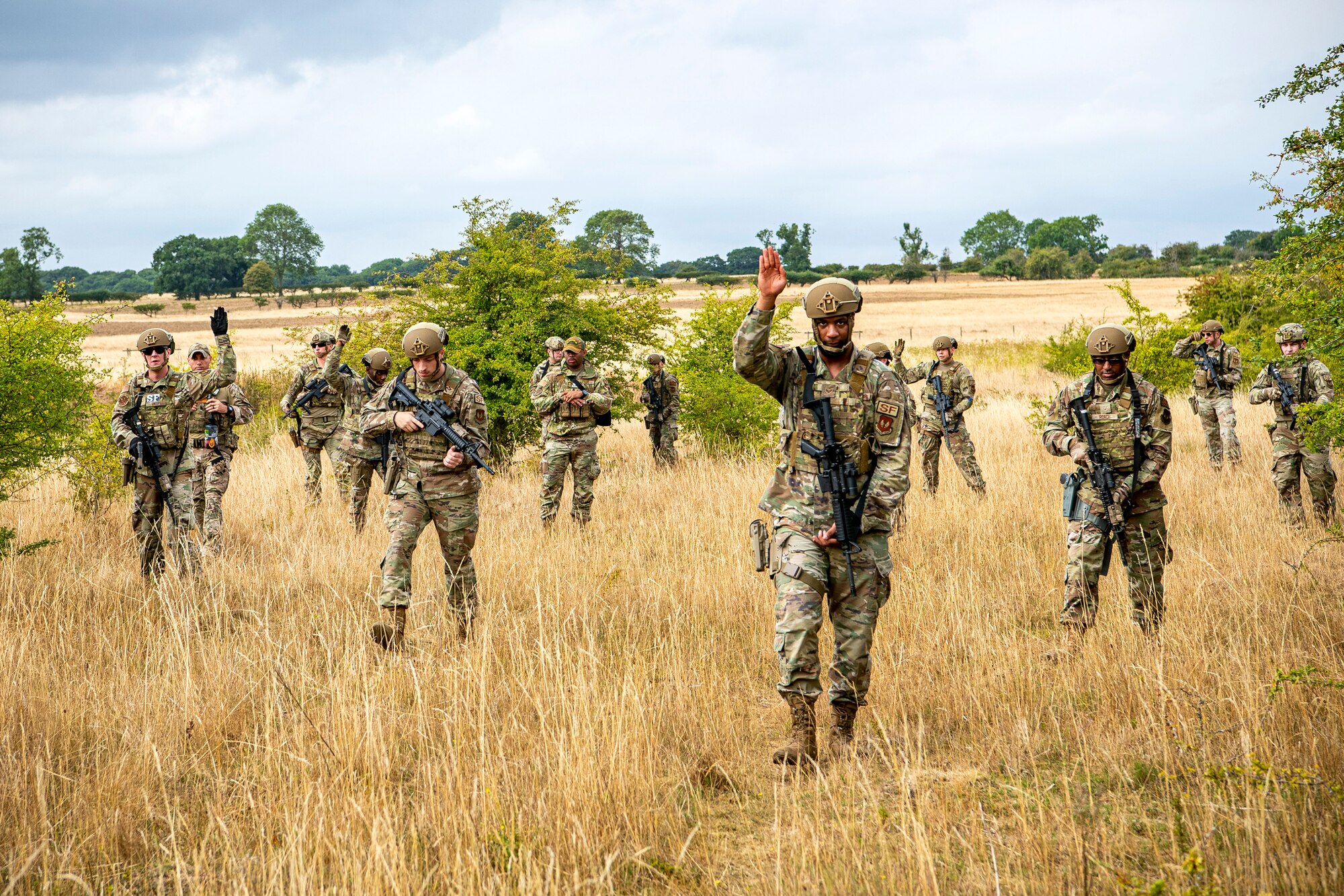 Airmen from the 423d Security Forces Squadron hold their position during a field training exercise at Stanford Training Area, England, Aug. 17, 2022. Instructors from the 820th Base Defense Group and 435th Security Forces Squadron Ground Combat Readiness Training Center, conducted the exercise to evaluate and bolster the combat readiness skills of the defenders from the 423d SFS. (U.S. Air Force photo by Staff Sgt. Eugene Oliver)