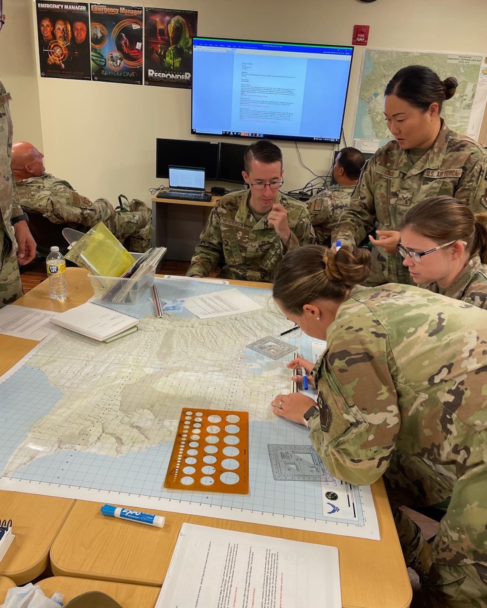 193rd Special Operations Emergency Management Airmen practice plotting points on a map to identity the regions affected by a simulated chemical, biological, radiological, or nuclear attack (CBRN) in Honolulu, Hawaii, July 25, 2022.