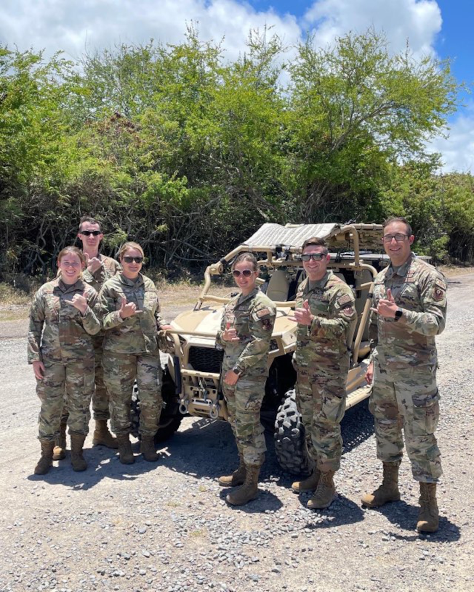 193rd Special Operations Emergency Management Airmen pose in front of a Polaris MRZR in Honolulu, Hawaii, July 25, 2022.