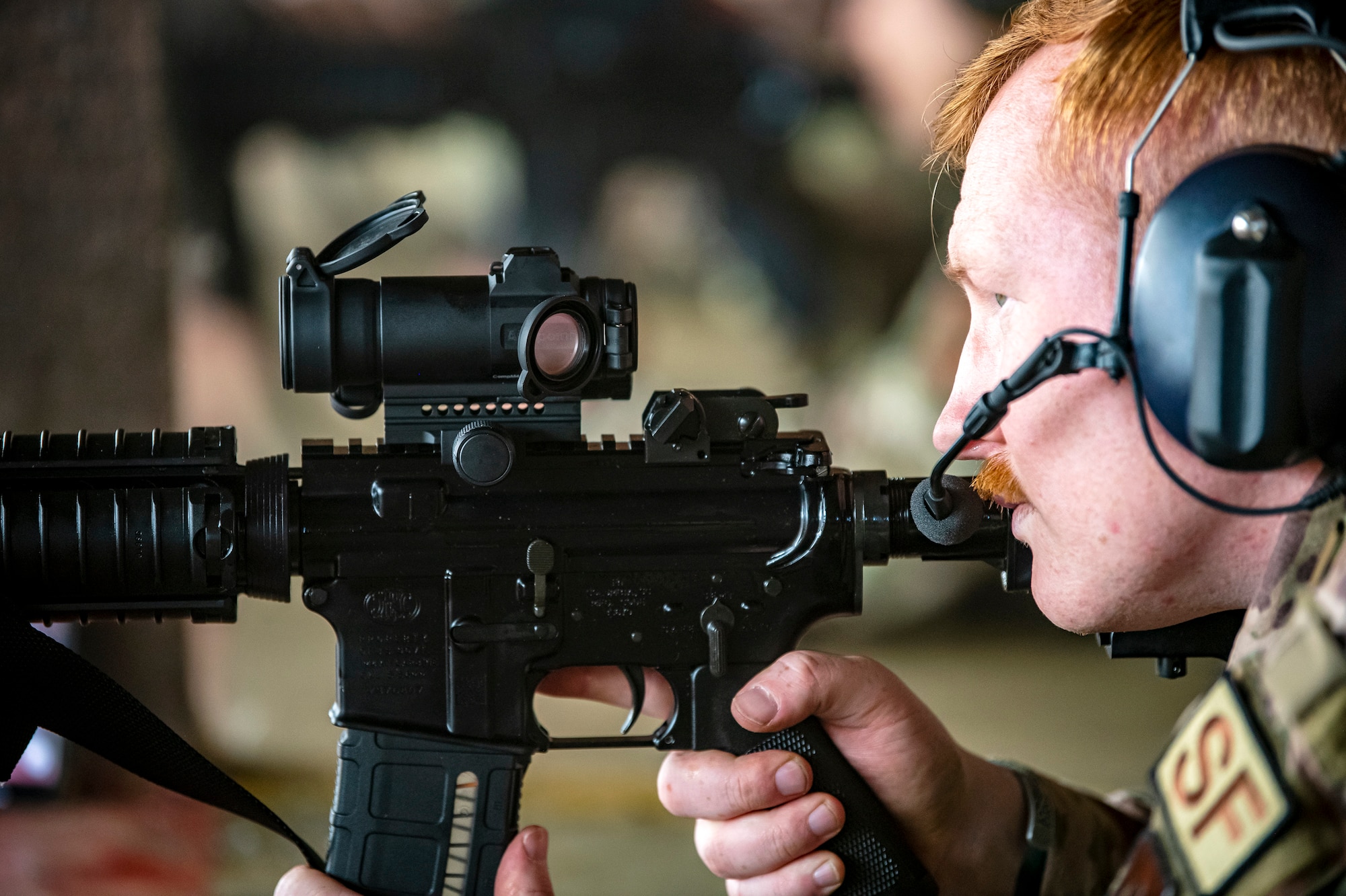 U.S. Air Force Staff Sgt. Michael Frisk, 423d Security Forces Squadron investigator, looks down the sight of an M4 carbine during a proficiency course at RAF Molesworth, England, Aug. 19, 2022. During the course instructors from the 820th Base Defense Group and 435th Contingency Response Group provided oversight and guidance to help critique and advance the combat arms skills of the defenders from the 423d SFS. (U.S. Air Force photo by Staff Sgt. Eugene Oliver)