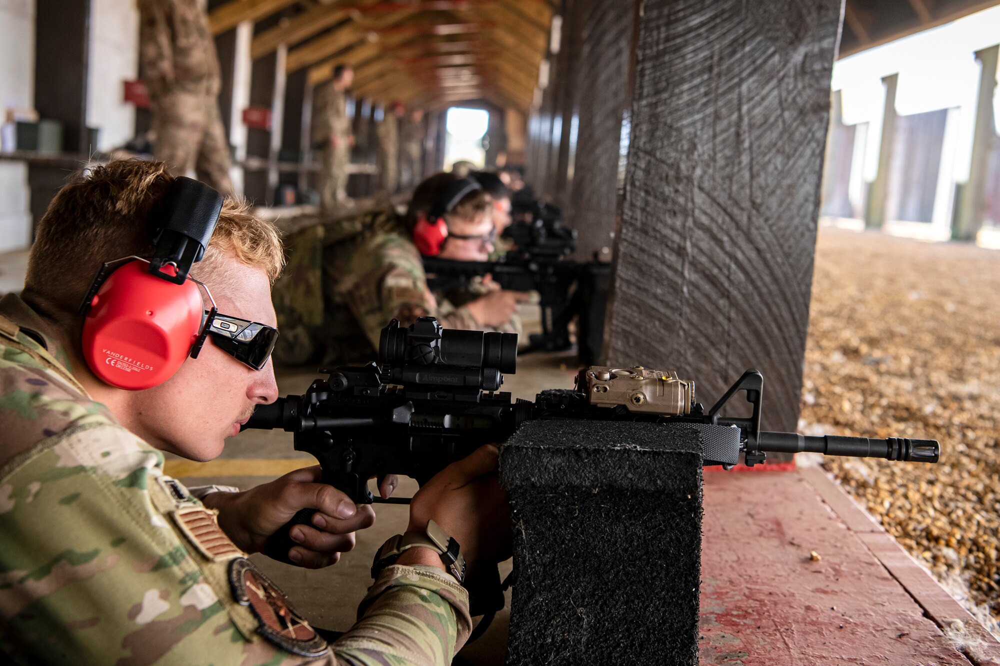 Airmen from the 423d Security Forces Squadron fire their M4 carbines during a proficiency course at RAF Molesworth, England, Aug. 19, 2022. During the course instructors from the 820th Base Defense Group and 435th Contingency Response Group provided oversight and guidance to help critique and advance the combat arms skills of the defenders from the 423d SFS. (U.S. Air Force photo by Staff Sgt. Eugene Oliver)