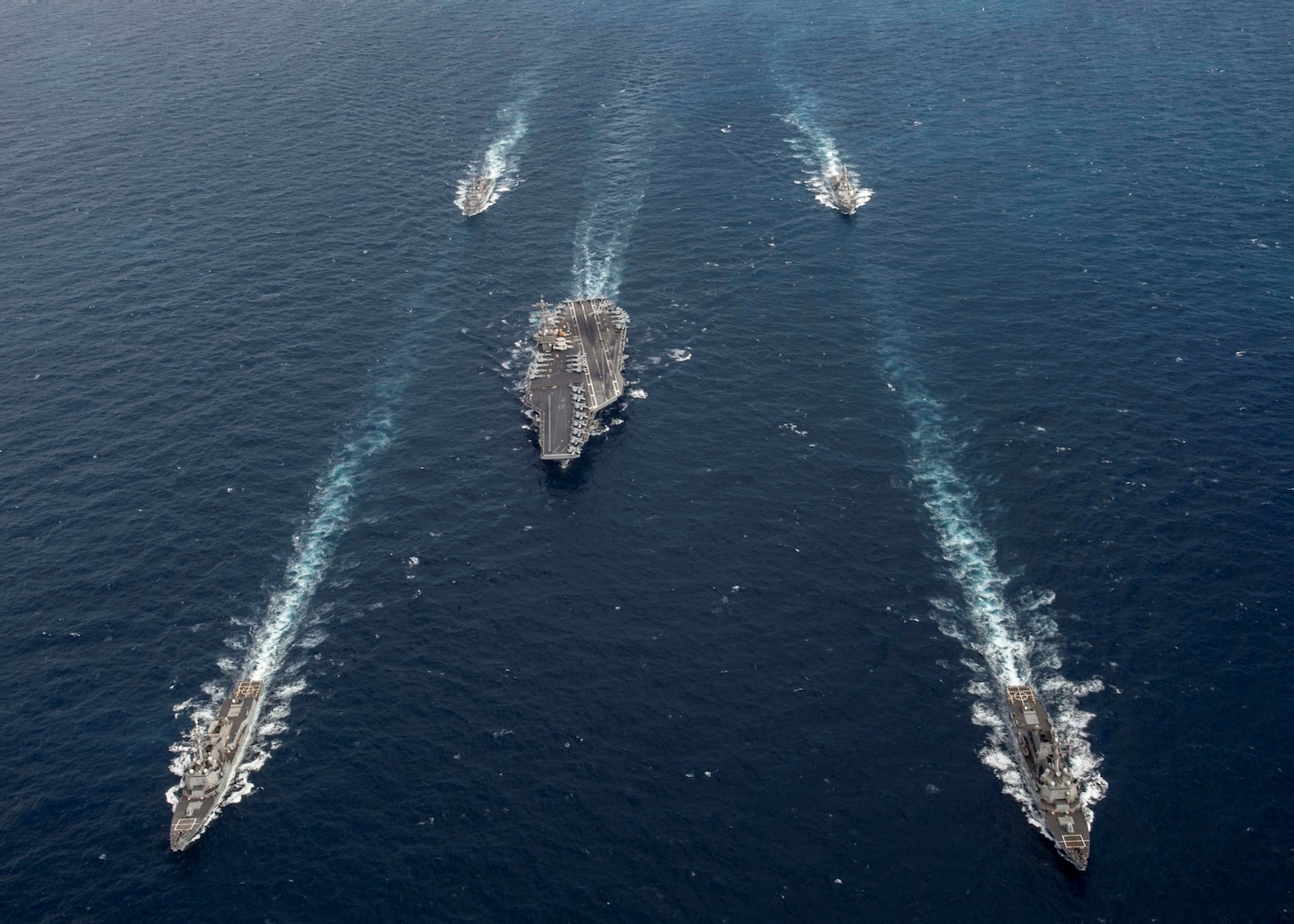 Ships from the George H.W. Bush Carrier Strike Group (GHWBCSG) transit the Atlantic Ocean following a straits transit training event. GHWBCSG is underway completing Group Sail as part of the routine training cycle.