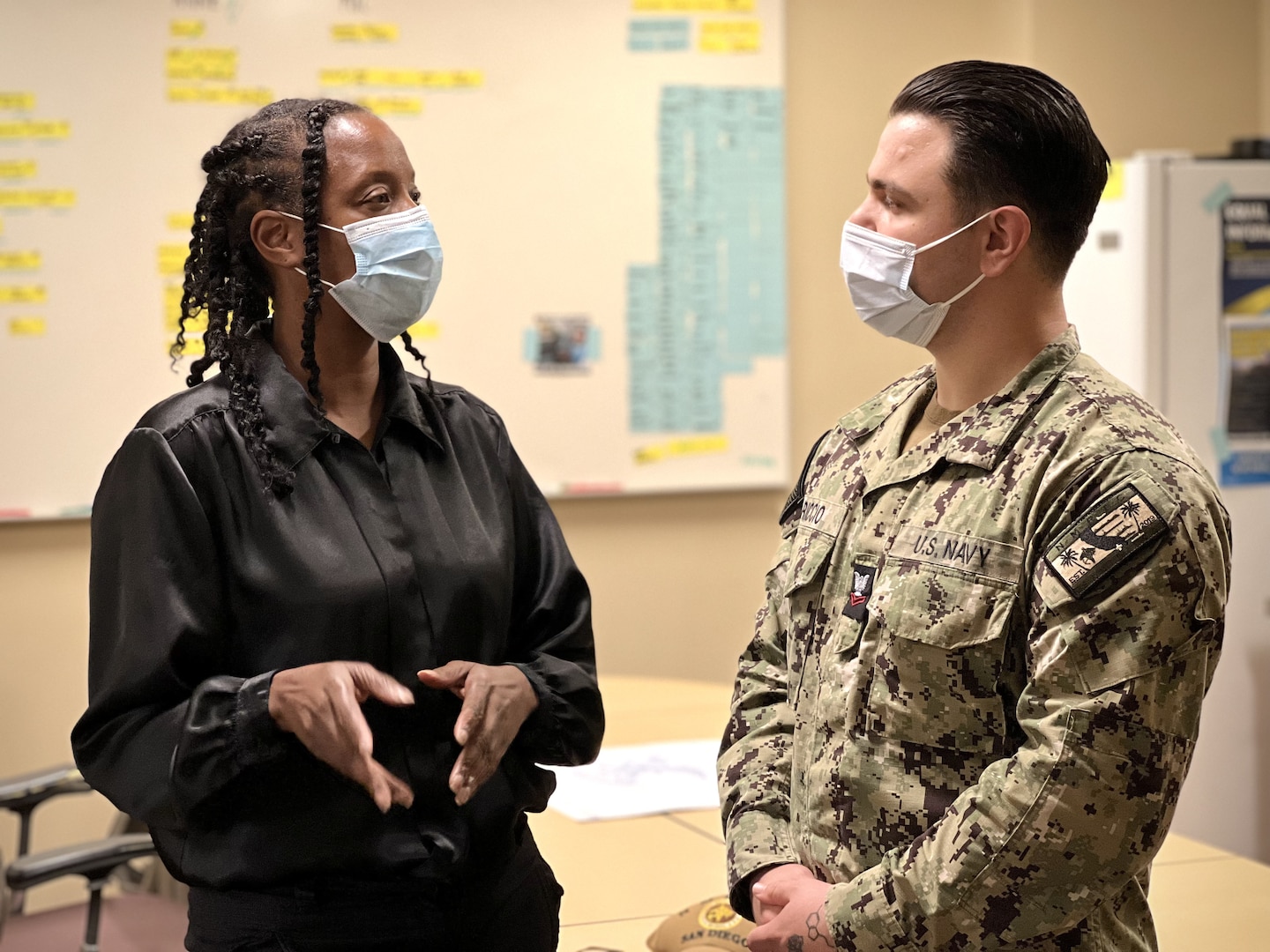 At Naval Medical Center San Diego (NMCSD) staff members Vicky Broadnax, NMCSD safety program officer and Hospital Corpsman 2nd Class Giuseppe Riccio, NMCSD Command Master Chief executive assistant, Drug and Alcohol Program Advisor (DAPA) representative and Coalition of Sailors Against Destructive Decisions (CSADD) cabinet member engage in discussions th