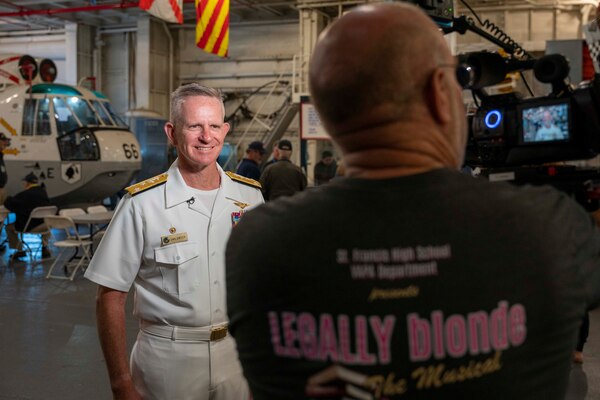 Vice Adm. Daniel Dwyer, commander, U.S. 2nd Fleet, speaks with local media aboard the USS Hornet Sea, Air and Space Museum during the 100th Anniversary of the Aircraft Carrier ceremony in Alameda, Calif., August 13.