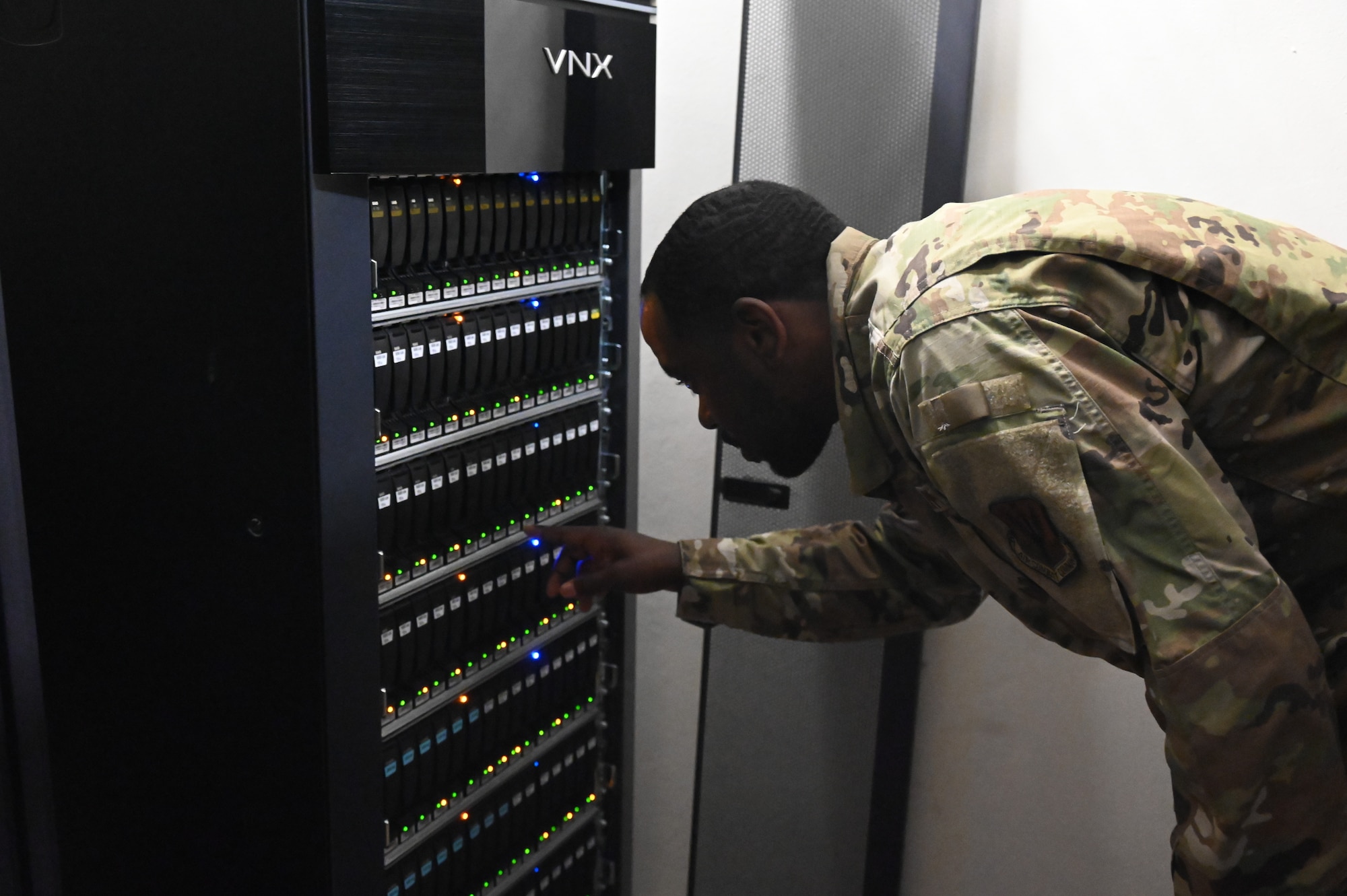 U.S. Air Force Staff Sgt. Diontae West, a cyber systems operations journeyman assigned to the 175th Communications Flight, Maryland Air National Guard, inspects computer servers, July 19, 2022, during annual training at Aviano Air Base, Italy.