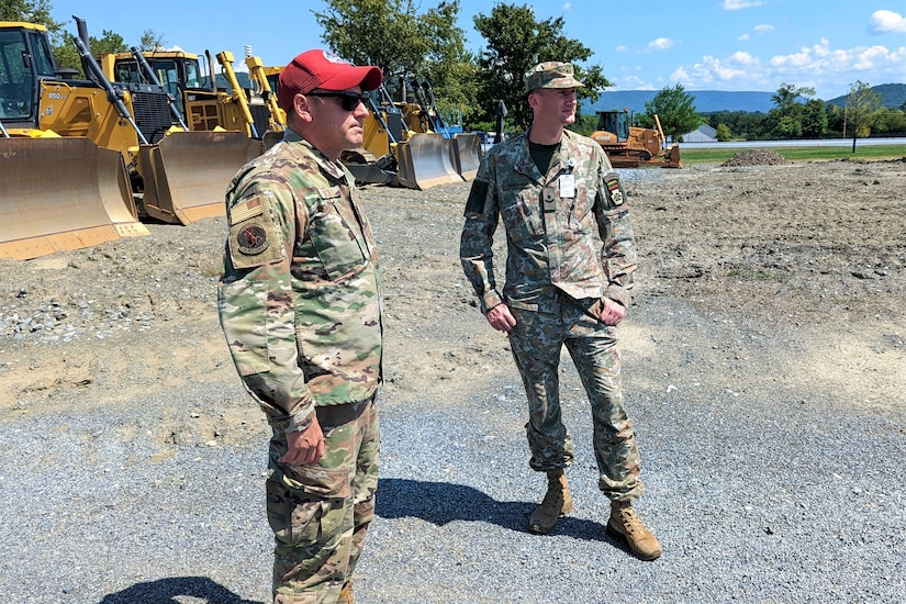 Maj. Mantas Kazakevičius (right), Lithuanian Armed Forces liaison officer to the Pennsylvania National Guard, met with Pennsylvania Air National Guard engineers and senior leaders Aug. 24, 2022, at Fort Indiantown Gap, Pa.