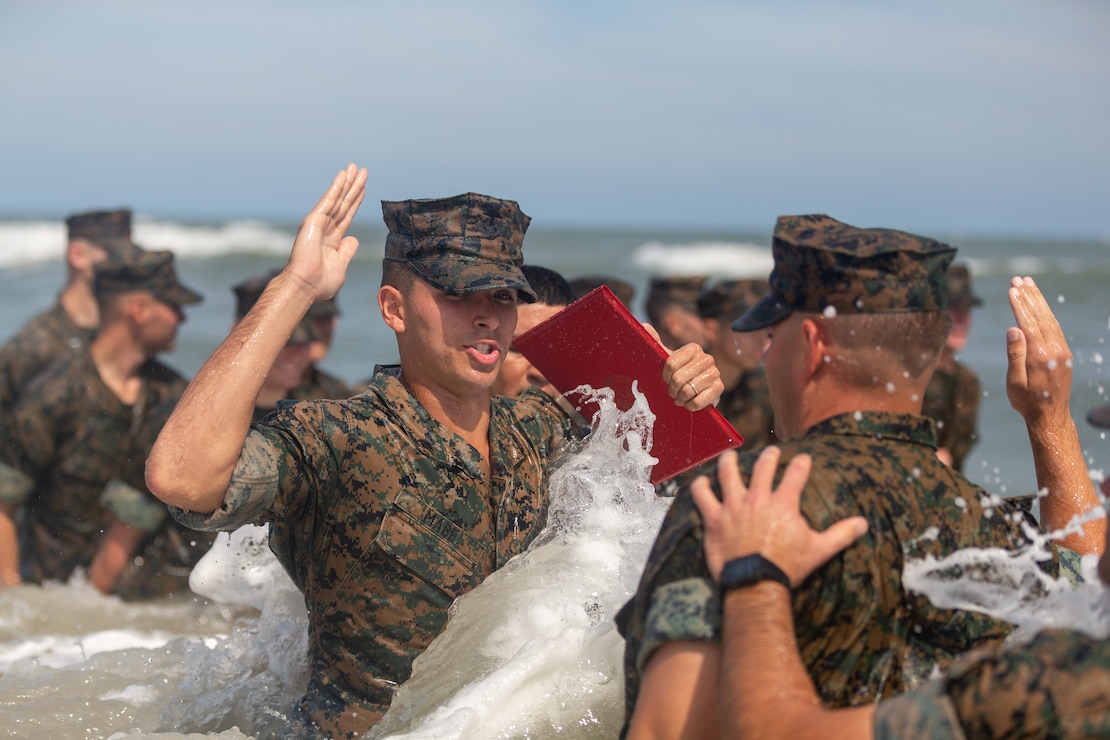 U.S. Marine Corps Cpl. Courtland Mabe, a Douglasville, Georgia, native and anti-tank missile gunner with 2d Light Armored Reconnaissance Battalion, 2d Marine Division, recites the Oath of Enlistment  on Camp Lejeune, North Carolina, July 6, 2022. Mabe was selected for reenlistment through the Commandant’s Retention Program which allows Marines that embody the whole Marine concept and represent the top echelon of Marines to bypass the twenty-step reenlistment process. (U.S. Marine Corps photo by Lance Cpl. Ryan Ramsammy)