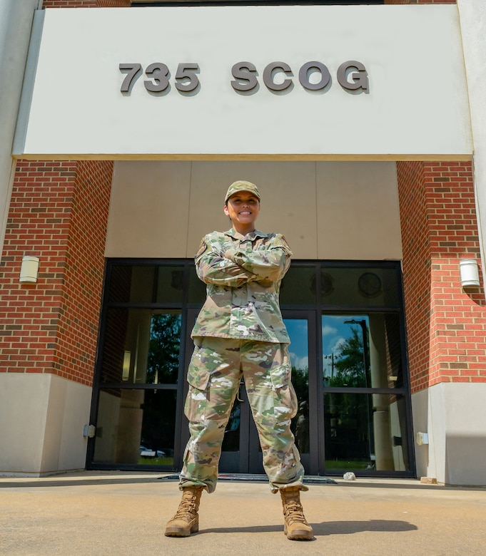 U.S. Air Force Tech. Sgt. Jennifer Gloria “JT” Thomas, 441st Vehicle Support Chain Operations Squadron, noncommissioned officer in charge of vehicle disposition and lease management, stands outside of the 735th Supply Chain Operations Group building at Joint Base Langley-Eustis, Virginia.