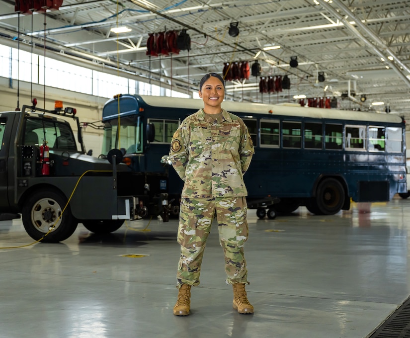 U.S. Air Force Tech. Sgt. Jennifer Gloria “JT” Thomas, 441st Vehicle Support Chain Operations Squadron, noncommissioned officer in charge of vehicle disposition and lease management, stands in front of vehicle assets at Joint Base Langley-Eustis, Virginia.