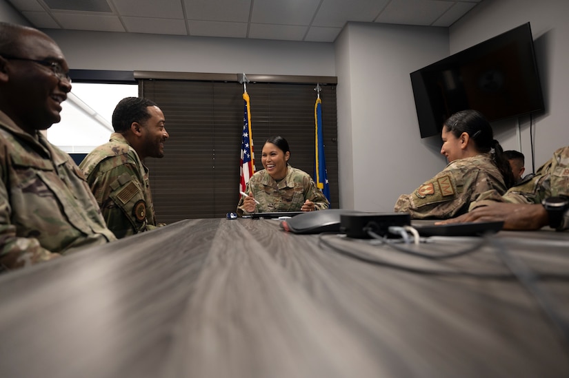U.S. Air Force Tech. Sgt. Jennifer Gloria “JT” Thomas, 441st Vehicle Support Chain Operations Squadron, noncommissioned officer in charge of vehicle disposition and lease management, leads a team meeting in the 441st VSCOS conference room at Joint Base Langley-Eustis, Virginia. ce room at Joint Base Langley-Eustis, Virginia, Aug. 16, 2022. Thomas is the first Airmen from her career field to win the 12 Outstanding Airmen of the Year award for her dedication to mission success by suppling vehicles needed to assist in humanitarian and warfighting capabilities, all while aiding in her husband’s road to leukemia remission.