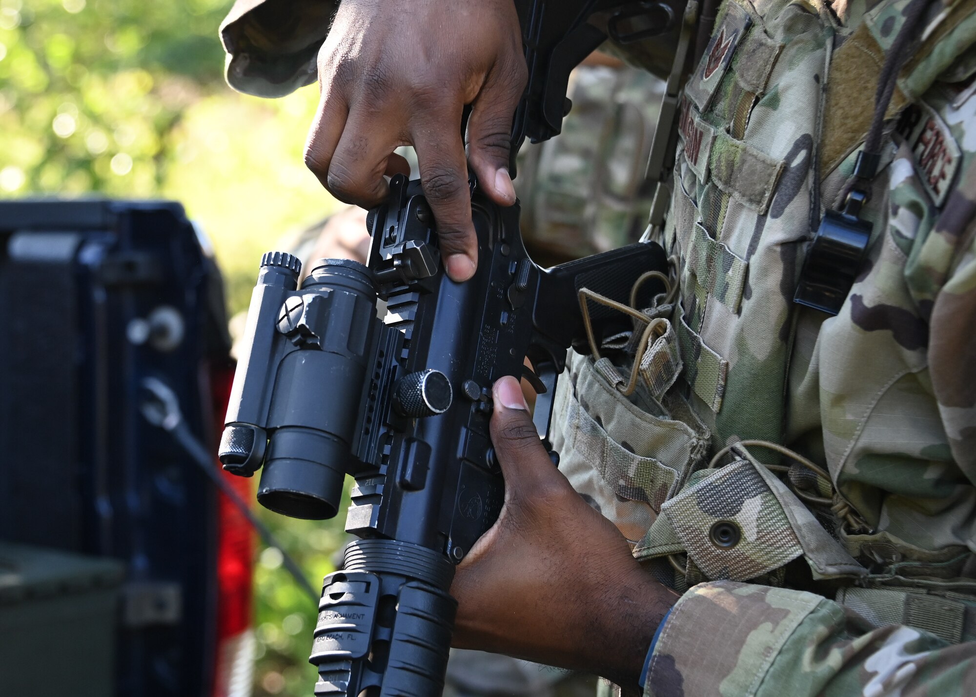 Tech. Sgt. Raymond Simpson, 316th Security Support Squadron NCO in charge of training, prepares an M4 Carbine for an annual weapons proficiency training exercise at Joint Base Andrews, Md., Aug. 23, 2022. Simpson, along with another instructor, led three Airmen through the exercise to enhance their technical skills. (U.S. Air Force Airman 1st Class Isabelle Churchill)
