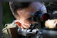 Tech. Sgt. Reece Dinofsky, 316th Security Support Squadron assistant NCO in charge of training, aims an M4 Carbine toward a target during a weapons proficiency training exercise at Joint Base Andrews, Md., Aug. 23, 2022. Dinofsky acted as a mentor to three Airmen throughout the “shoot, move, communicate” exercise and created simulated events to enhance their training. (U.S. Air Force photo by Airman 1st Class Isabelle Churchill)