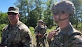 Sgt. 1st Class Ron Hesson, Army National Group Operations Group Wolf Fire Support Team senior observer, coach/trainer, observes Soldiers from 1st Battalion, 134th Field Artillery Regiment, 37th Infantry Brigade Combat Team, during a call for fire mission at Northern Strike 2022 on August 9, 2022, at Camp Grayling, Michigan.