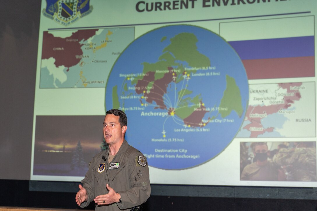 Photo of U.S. Air Force Col. Kevin Jamieson speaking in front of a projected slide.