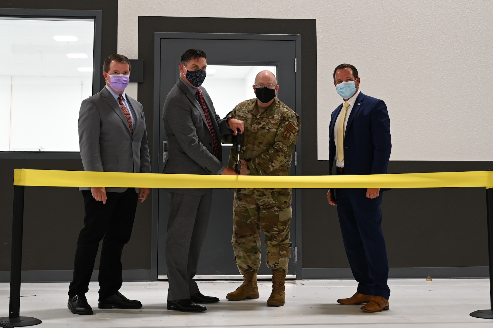 (From left to right) Chris Schuppe, general manager of engineering and technology at GE Additive, John Sneden, director of the Air Force Life Cycle Management Center’s Propulsion Directorate, Maj. Gen. Jeff King, commander of the Oklahoma City Air Logistics Complex, and Geoffrey Camp, director of Oklahoma’s Aerospace and Defense initiative, cut the ribbon at opening of the second Reverse Engineering and Critical Tooling lab.