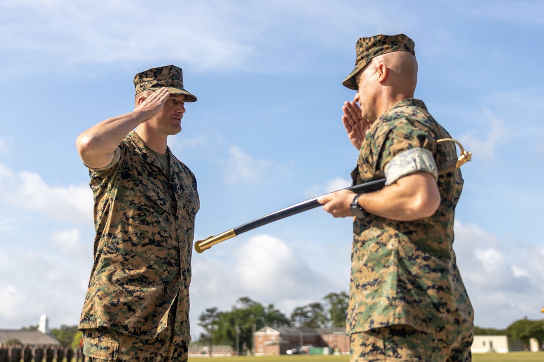 U.S. Marine Corps Sgt. Maj. Clifford P. Fincham (left), the incoming battalion sergeant major of Headquarters Battalion (HQBN), 2d Marine Division, salutes Col. Kemper A. Jones, the commanding officer of HQBN, 2d MARDIV, at a relief and appointment ceremony on Camp Lejeune, North Carolina, May 4, 2022. During the ceremony, Sgt. Maj. Keith D. Hoge, the outgoing sergeant major, relinquished his role of battalion sergeant major to Fincham. (U.S. Marine Corps photo by Lance Cpl. Deja Thomas)