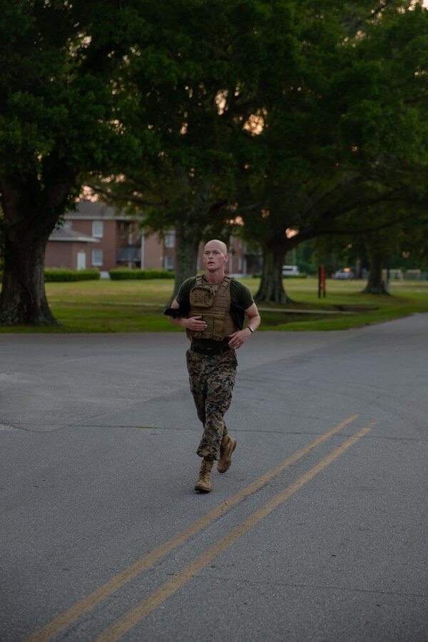 U.S. Marine Corps 1st Lt. Mark Grill, Communication Strategy and Operations Officer, 2d Marine Division, completes a 400m run during a workout of the day on Camp Lejeune, North Carolina, May 20, 2022.