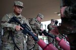 Basic military trainees learn weapons operations