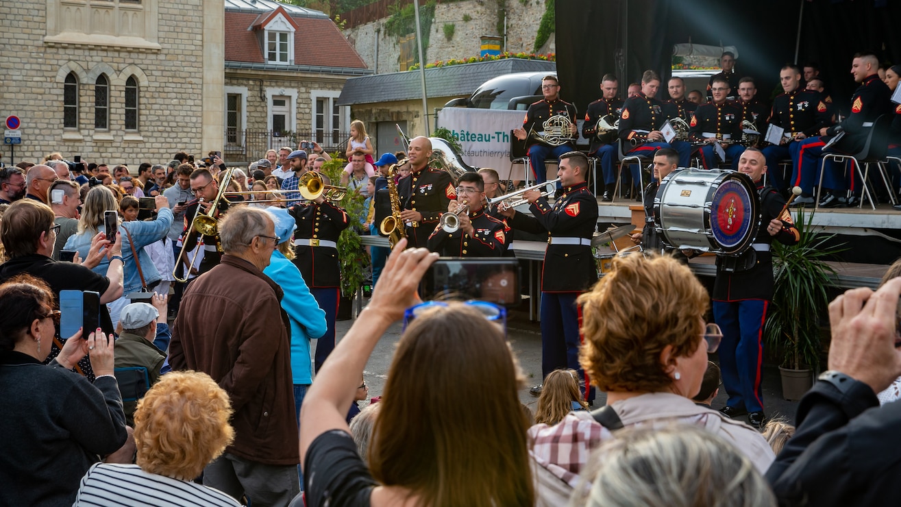 U.S Marines with the 2d Marine Division Band perform in front of the Town Hall in Chateau-Thierry, France, May 26, 2022. The Marines performed at Chateau-Thierry to commemorate the battles that Marines and American service members fought in the surrounding area during World War I. (U.S. Marine Corps photo by Cpl. Jennifer E. Reyes)