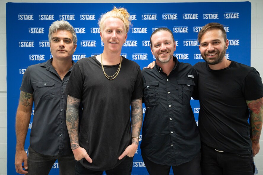 Members of the rock band We the Kings pose for a group photo before Rock Fest Aug. 20, 2022, at Malmstrom Air Force Base, Mont.