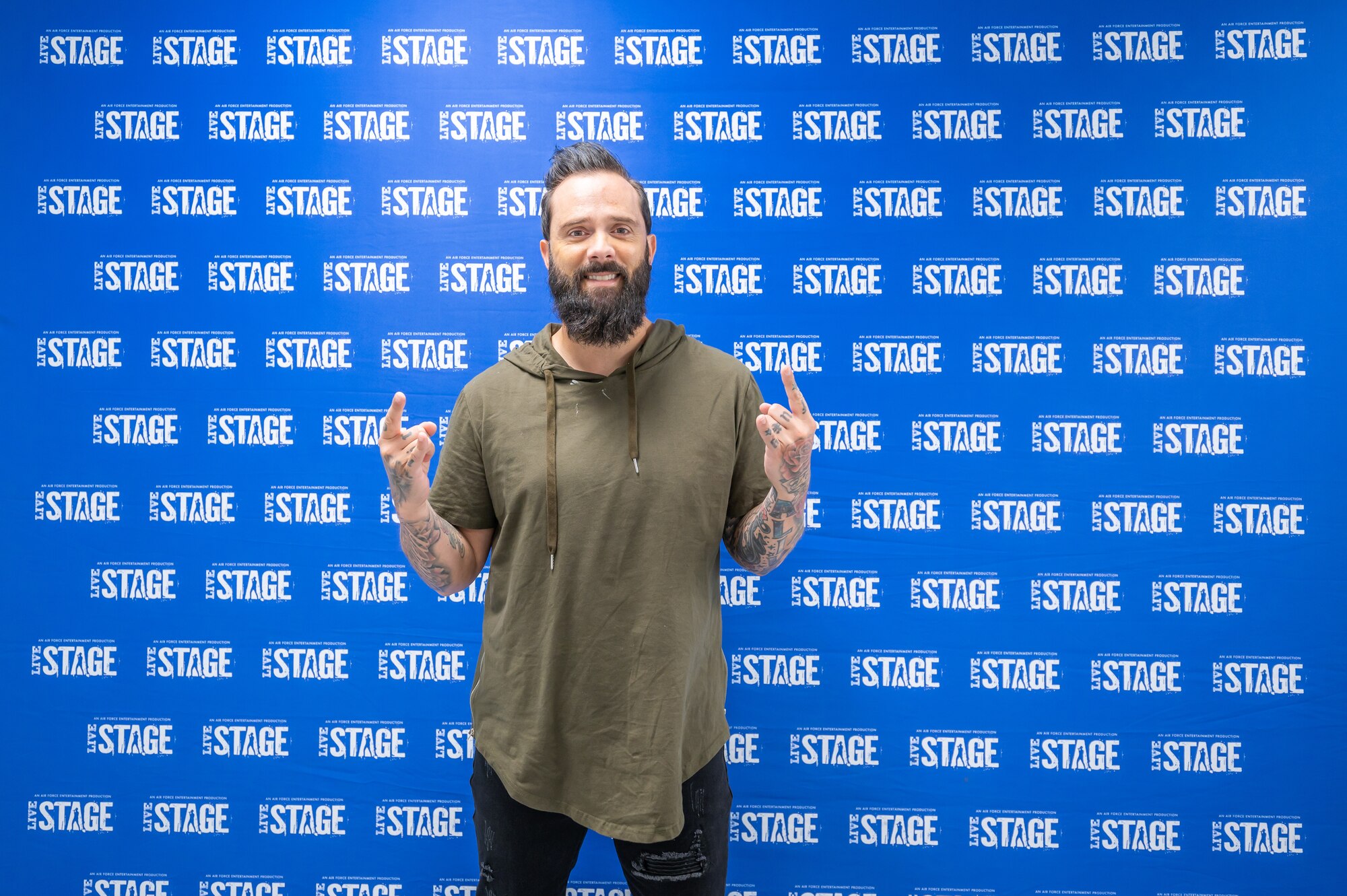 John Cooper, lead vocalist for the rock band Skillet, poses for a photo before Rock Fest Aug. 20, 2022, at Malmstrom Air Force Base, Mont.