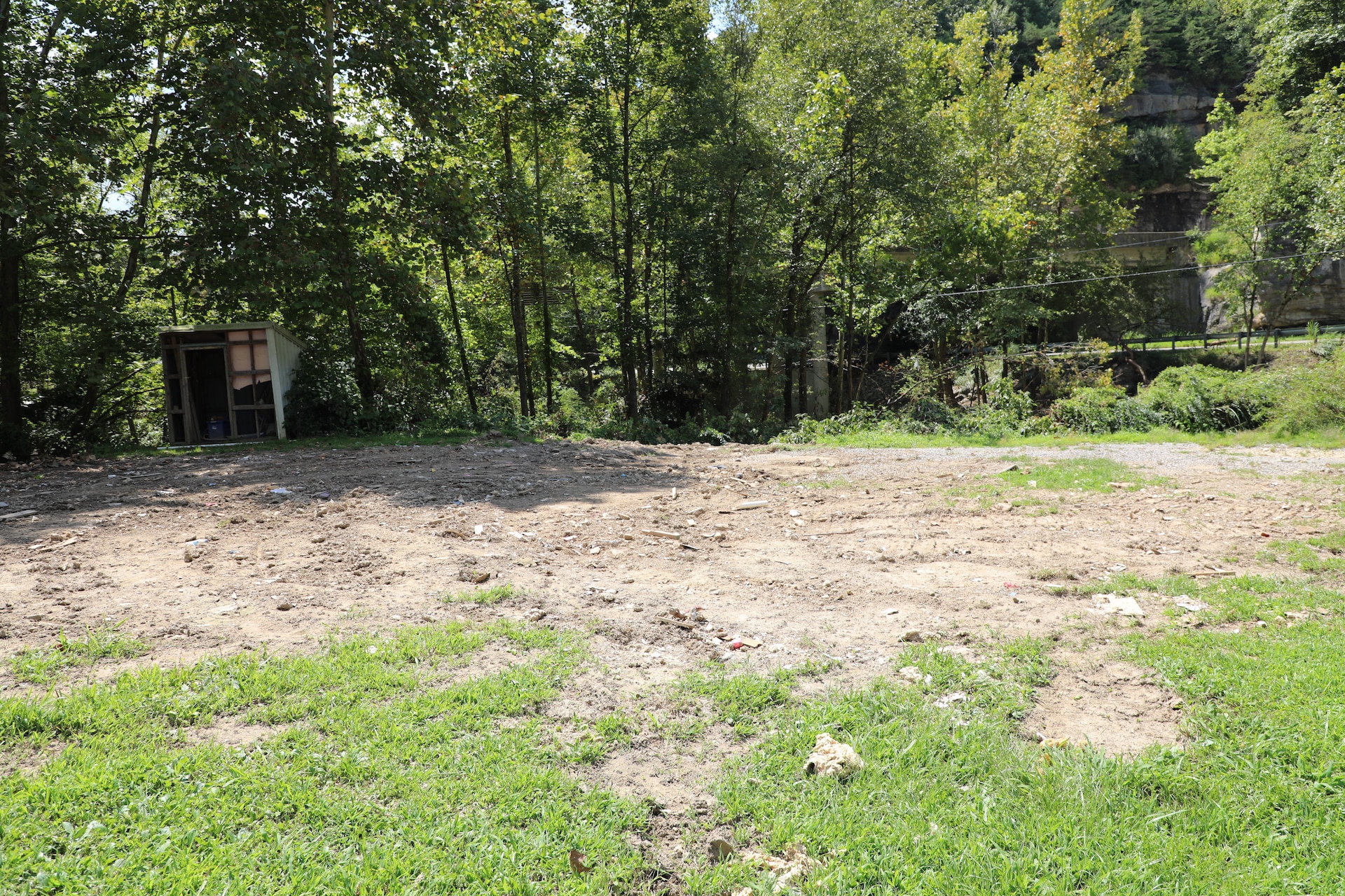 Personal belongings and trash line Troublesome Creek Aug. 19, 2022 in the aftermath of the flooding that happened last month. (U.S. Army National Guard photo by Sgt. 1st Class Benjamin Crane)