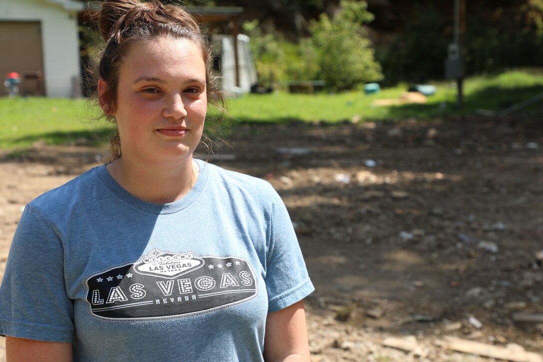 Army Sgt. Kathleen Thomassy-Mills poses with her family. Their home was destroyed in the flooding in Eastern Kentucky July 28, 2022.  (