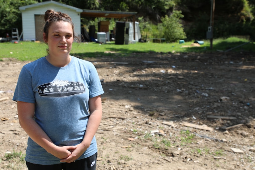 Army Sgt. Kathleen Thomassy-Mills poses with her family. Their home was destroyed in the flooding in Eastern Kentucky July 28, 2022.  (