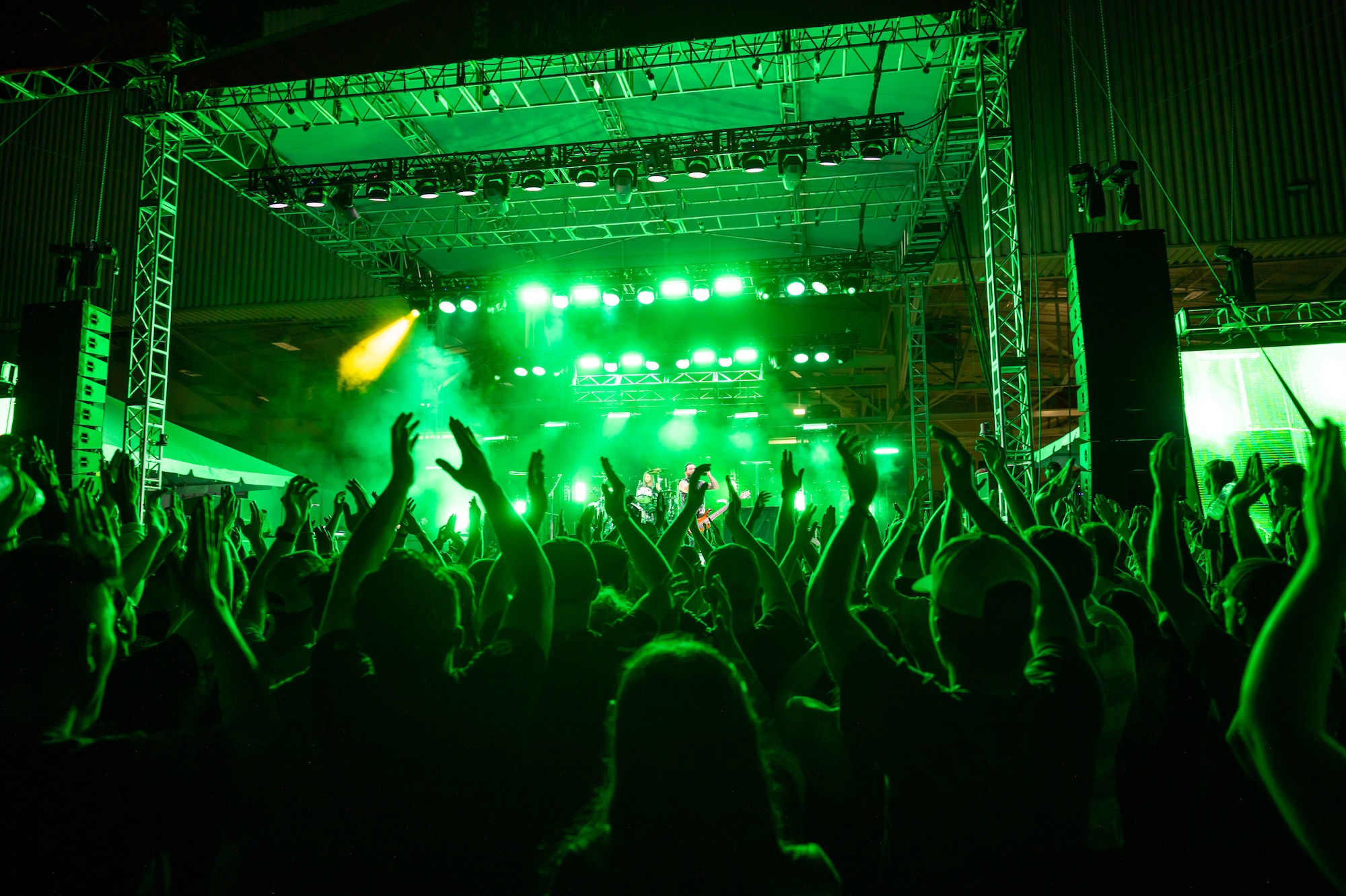 Audience members dance to a song played by the rock band Skillet during Rock Fest Aug. 20, 2022, at Malmstrom Air Force Base, Mont.
