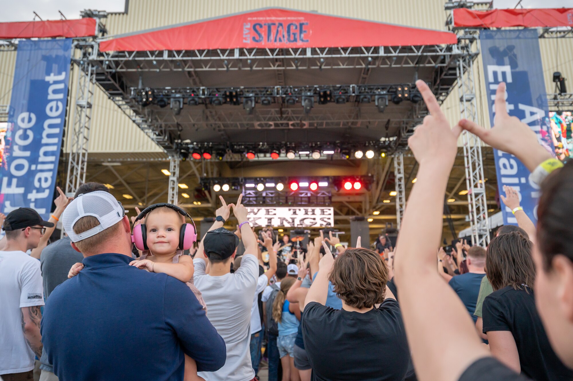 Audience members dance to a song played by the rock band We the Kings during Rock Fest Aug. 20, 2022, at Malmstrom Air Force Base, Mont.