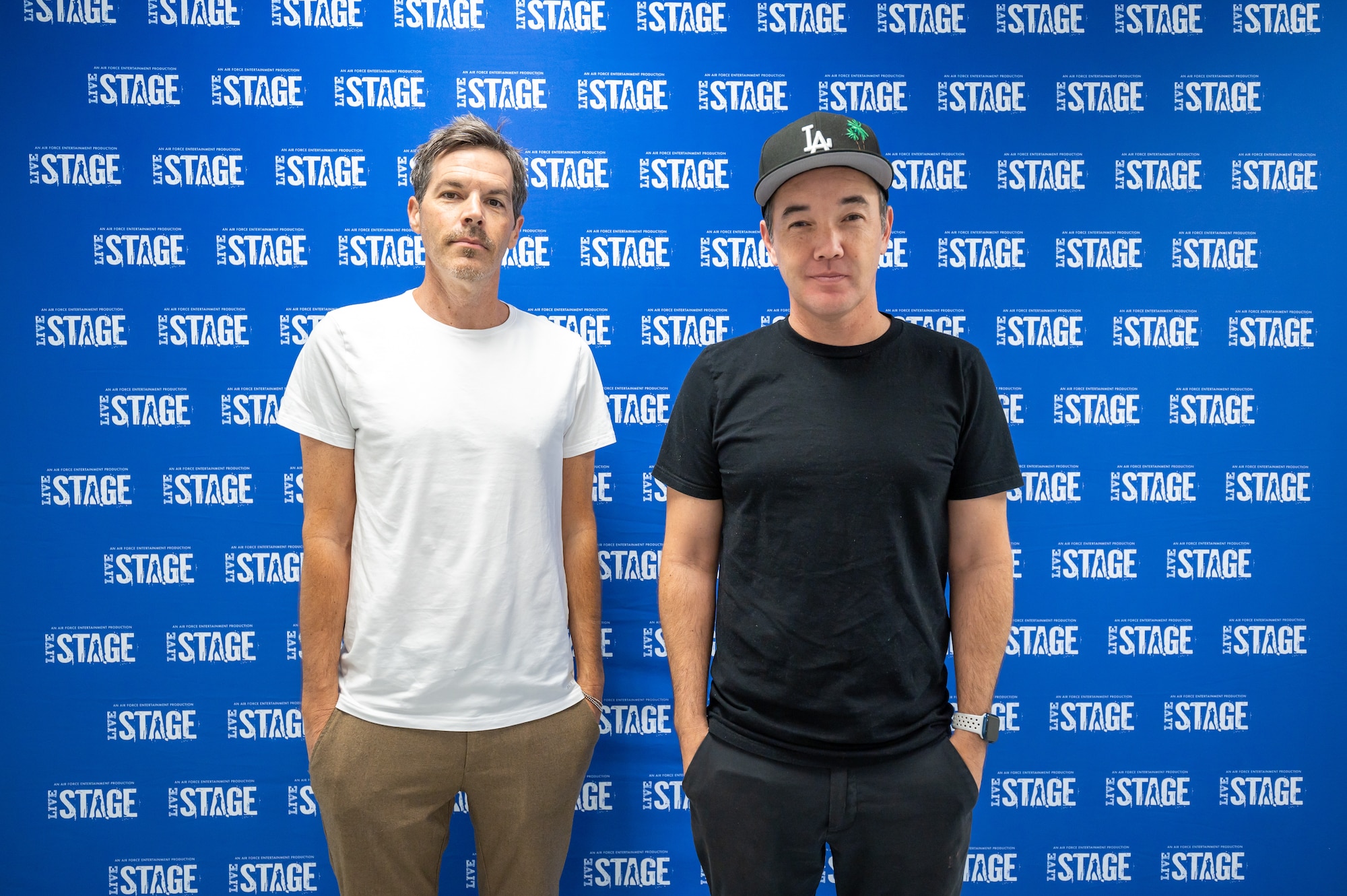 Dan Estrin, left, and Doug Robb, right, lead guitarist and lead vocalist for the rock band Hoobastank, pose for a photo before Rock Fest Aug. 20, 2022, at Malmstrom Air Force Base, Mont.