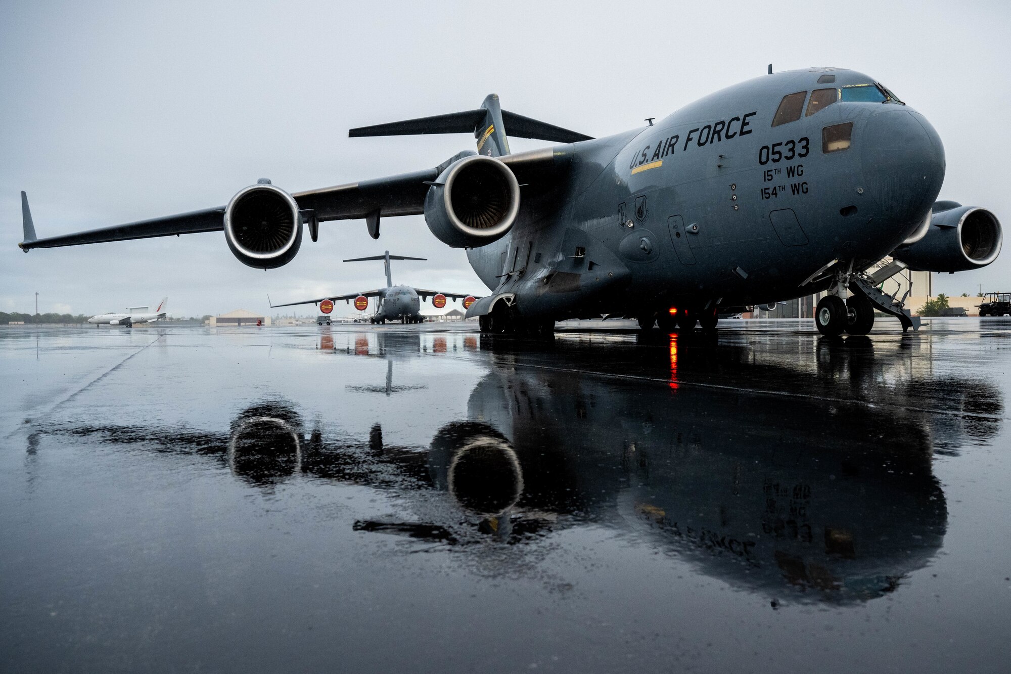 A C-17 Globemaster III awaits a mission in support of a training exercise at Joint Base Pearl Harbor-Hickam, Hawaii, Aug. 24, 2022. The C-17 is capable of strategically carrying troops and cargo to any operating base in the world. (U.S. Air Force photo by Senior Airman Makensie Cooper)