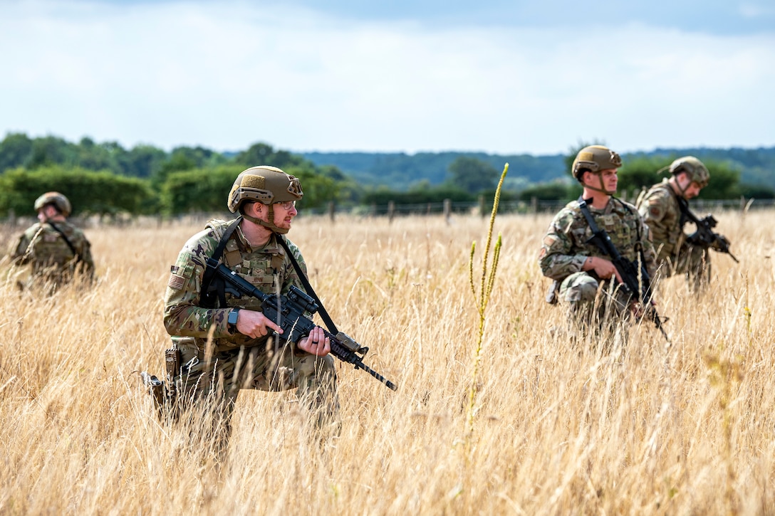 Airmen from the 423d Security Forces Squadron hold their position during a field training exercise at Stanford Training Area, England, Aug. 17, 2022. Instructors from the 820th Base Defense Group and 435th Security Forces Squadron Ground Combat Readiness Training Center, conducted the exercise to evaluate and bolster the combat readiness skills of the defenders from the 423d SFS. (U.S. Air Force photo by Staff Sgt. Eugene Oliver)