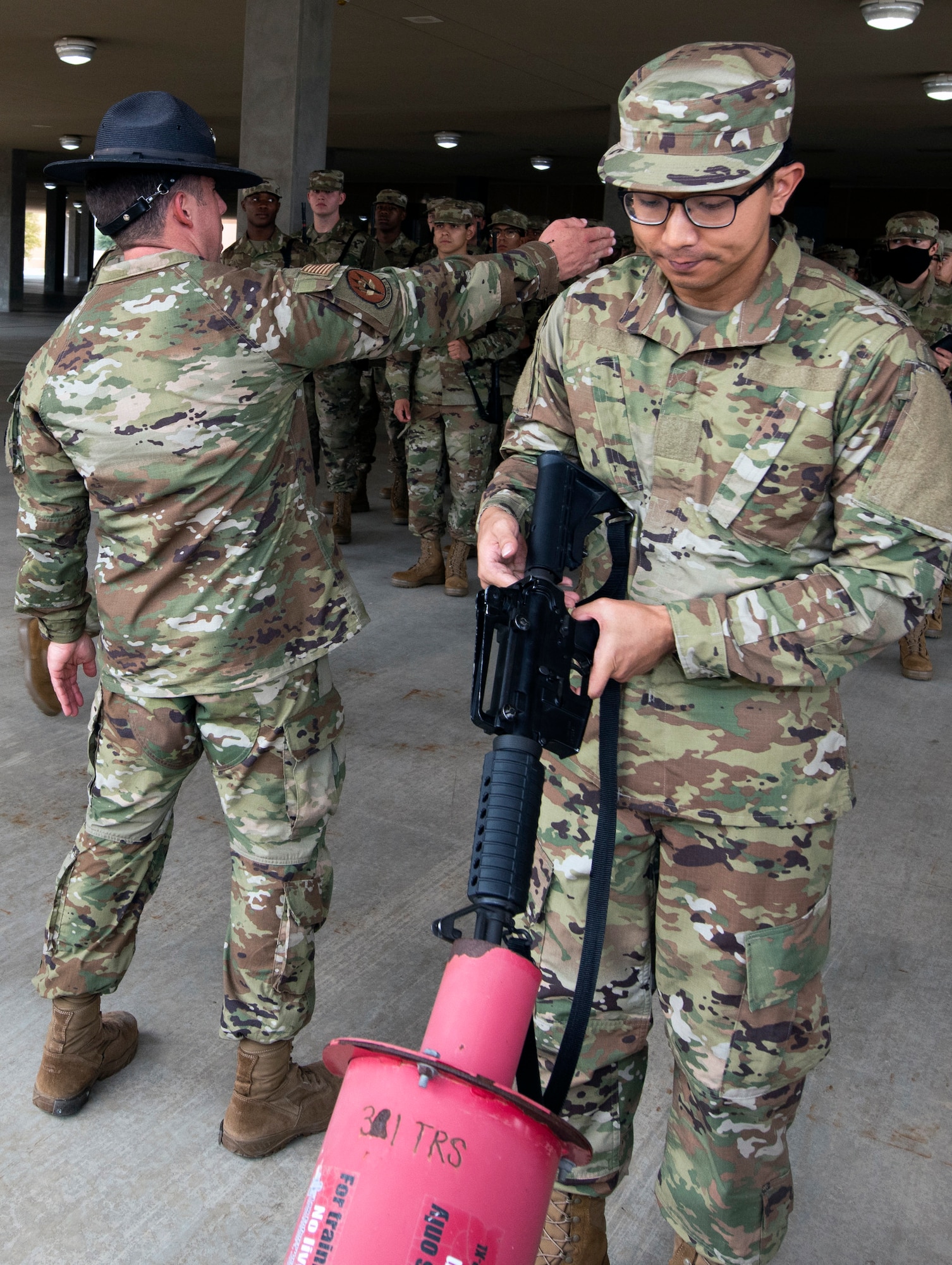 Basic military trainees learn weapons operations