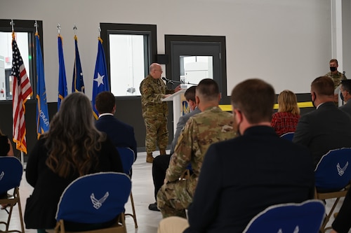 Maj. Gen. Jeff King, Oklahoma City Air Logistics Complex commander, stands behind podium addressing guests at the ribbon cutting for the second Reverse Engineering and Critical Tooling lab.