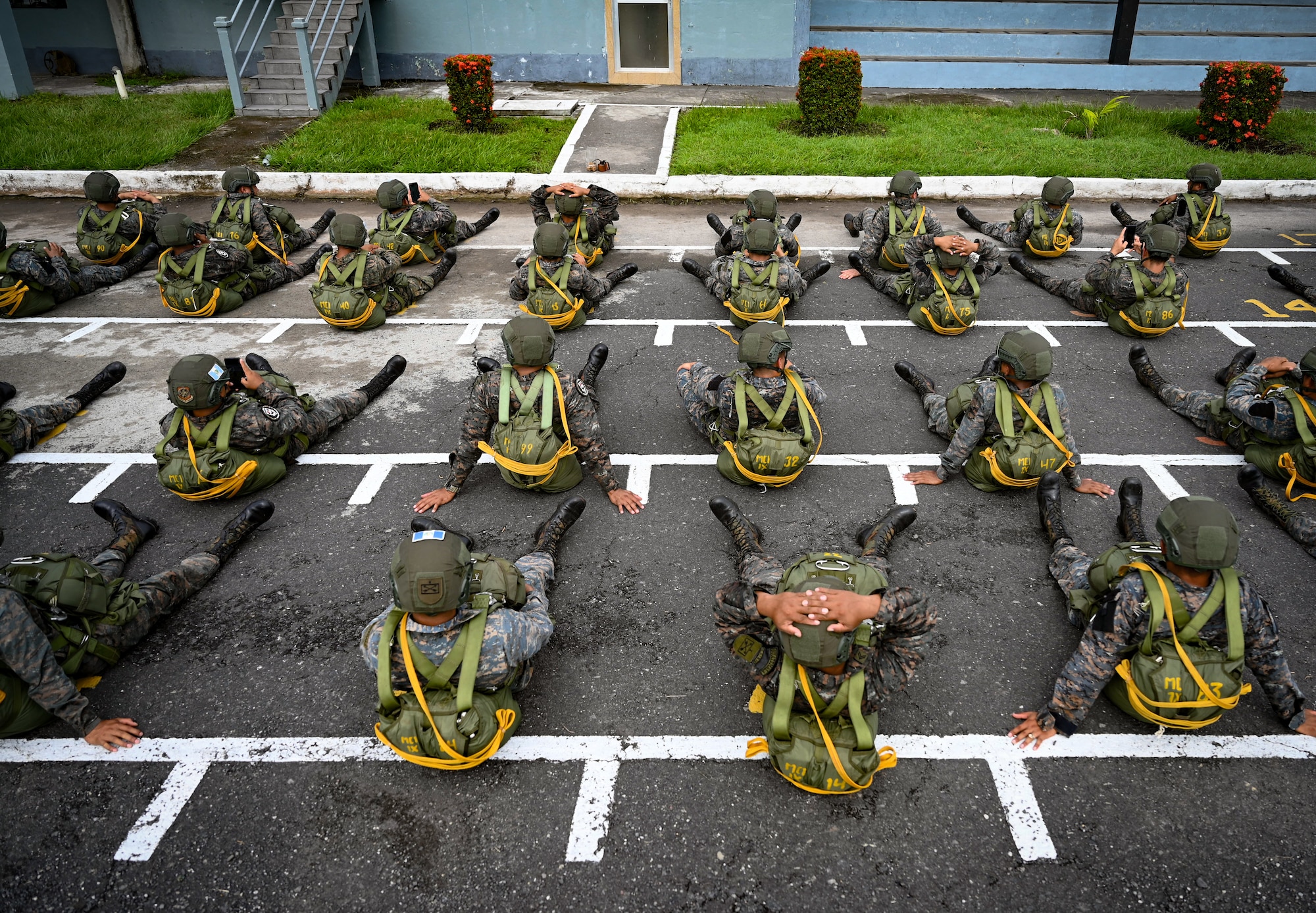 Photo of Service members in the Guatemalan military awaiting a static line jump aboard a C-130J Super Hercules over Guatemala.